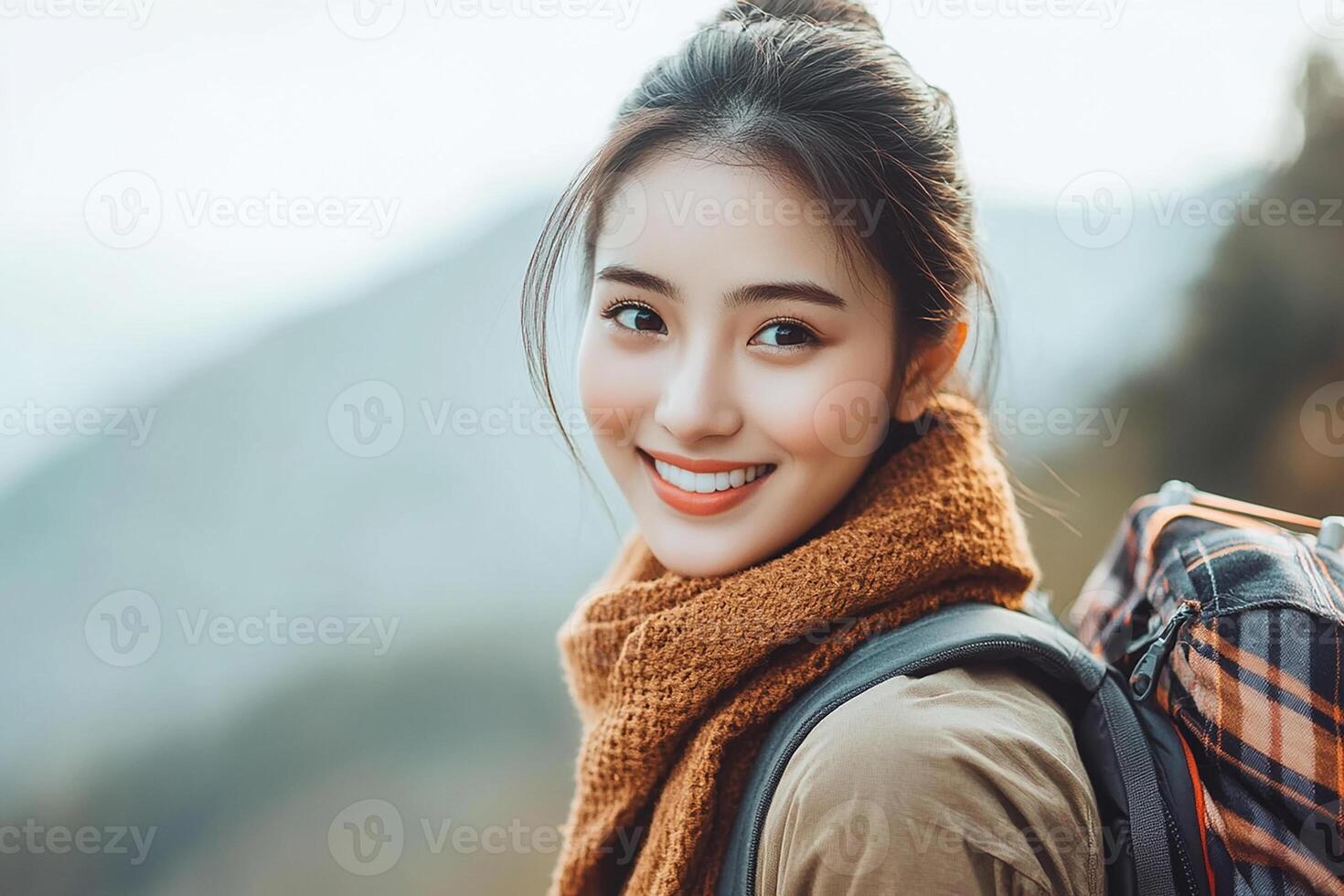 A woman with a backpack smiling photo