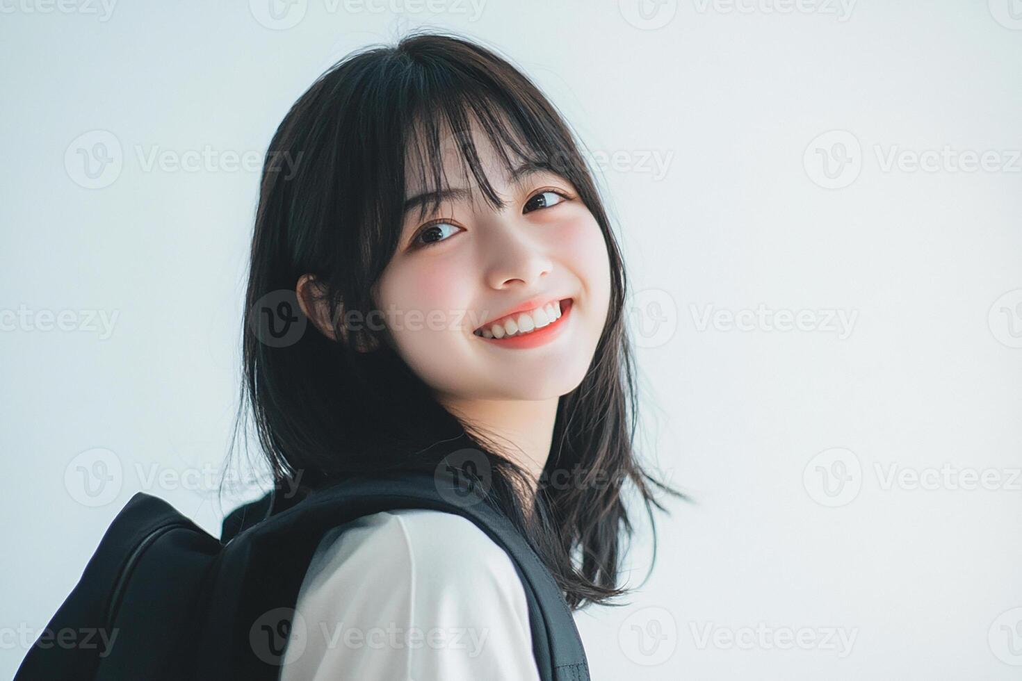Asian girl with backpack smiling photo