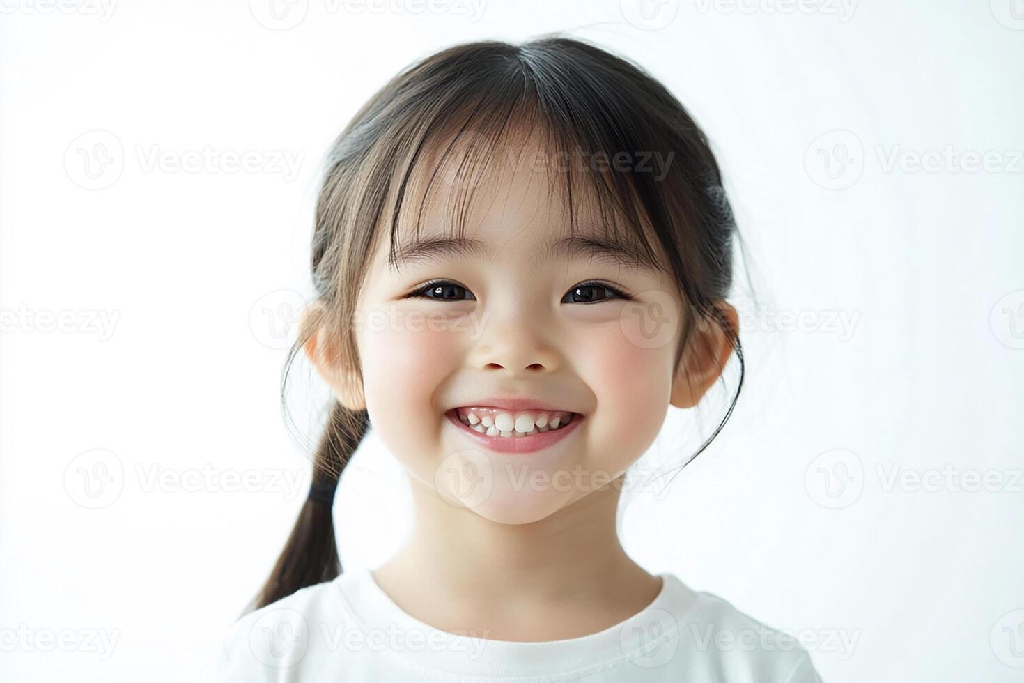 A little girl with long hair and a white shirt photo