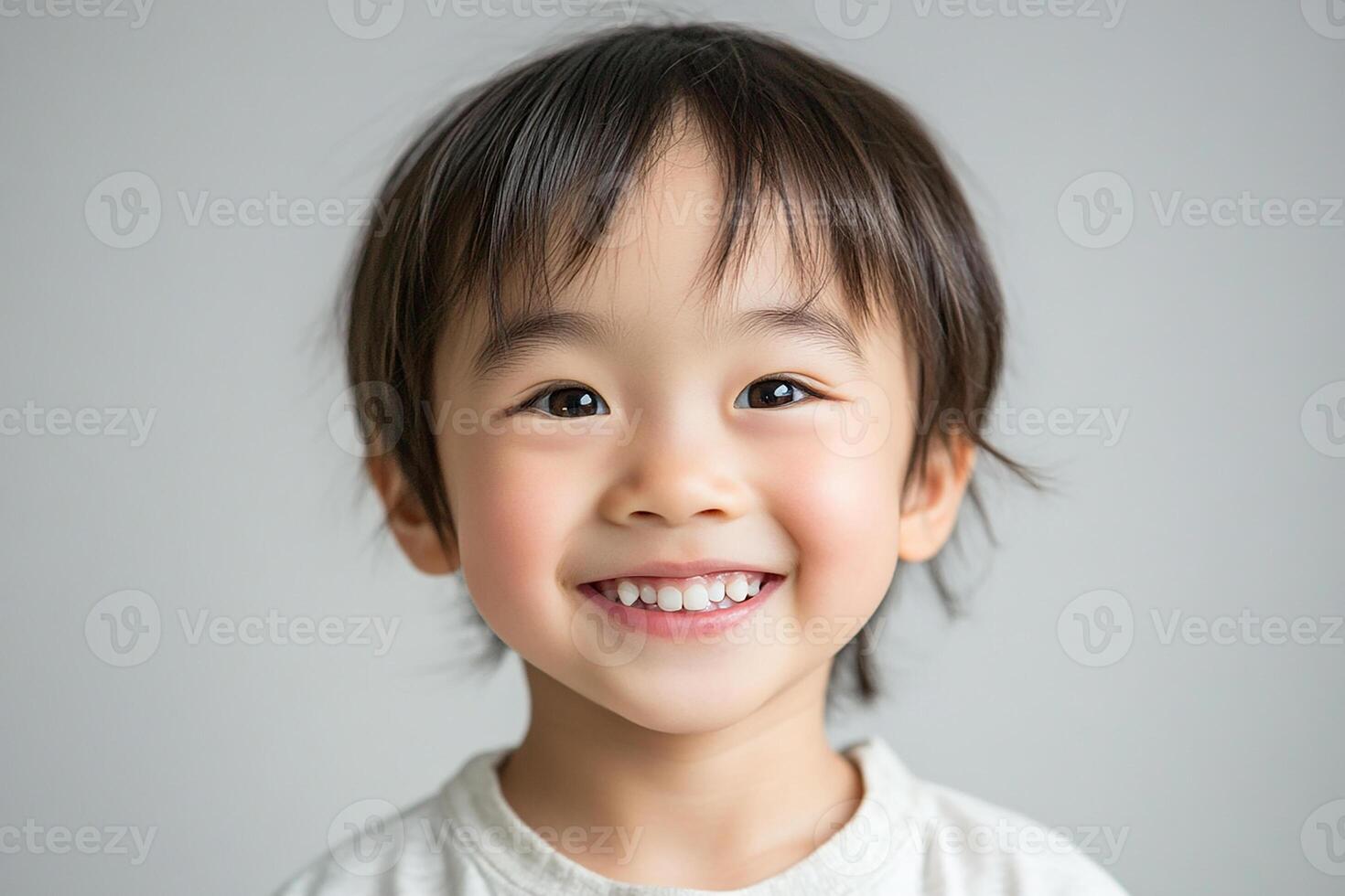 A little boy with a smile on his face photo