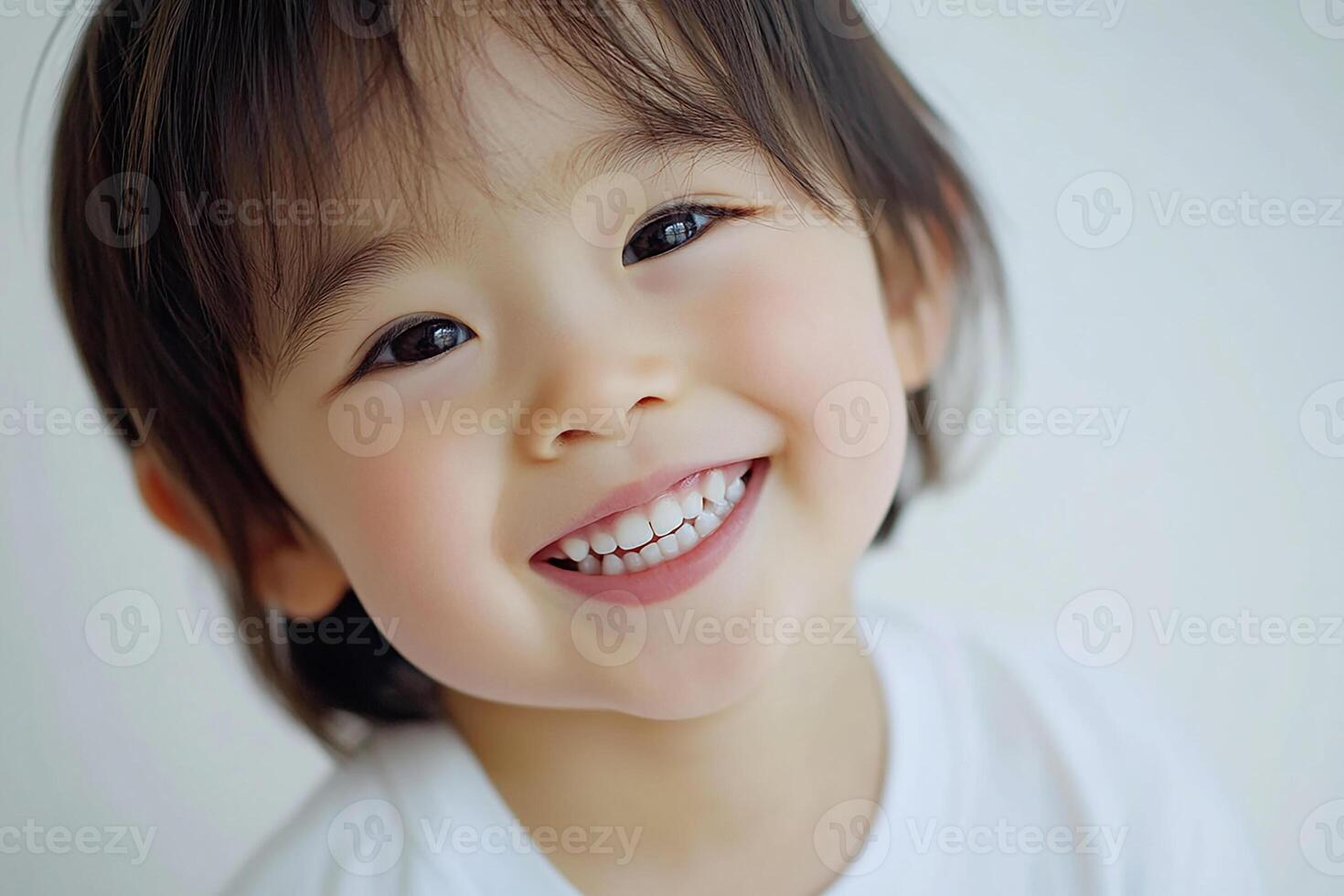 A young child smiles for the camera photo