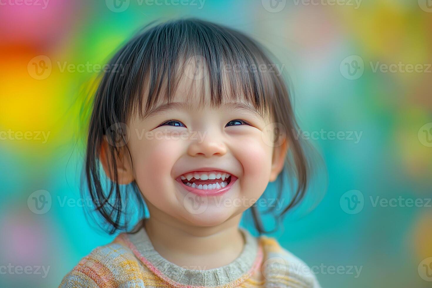 A little girl is smiling and laughing photo