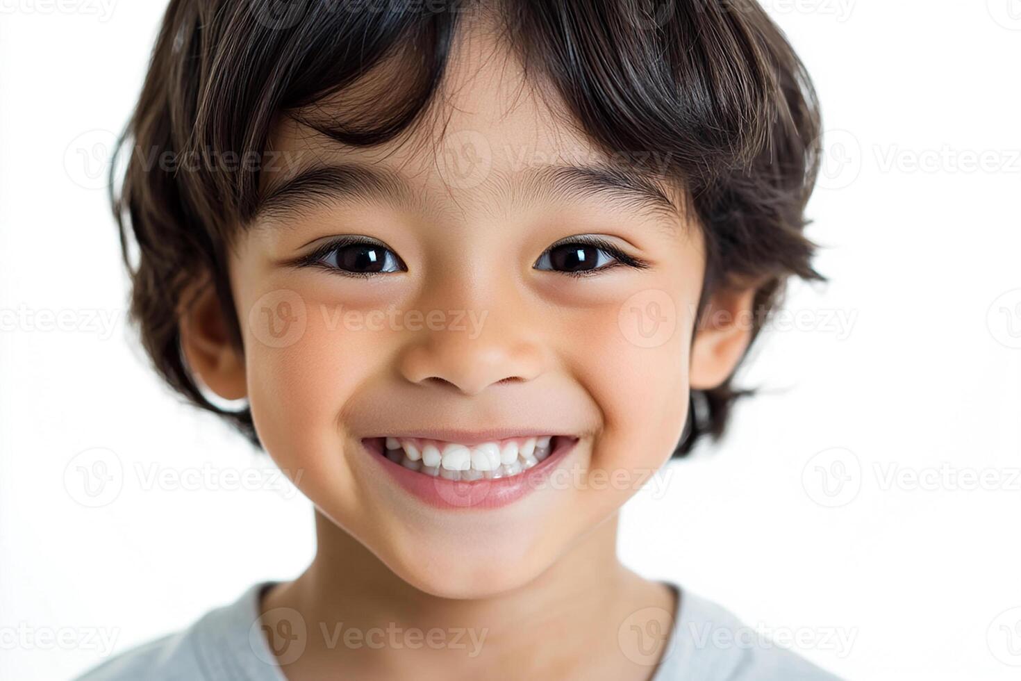 A young boy smiles for the camera photo