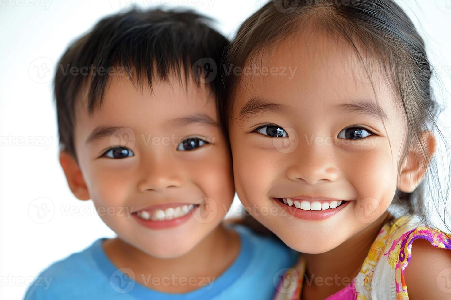 Two young children are smiling for the camera photo