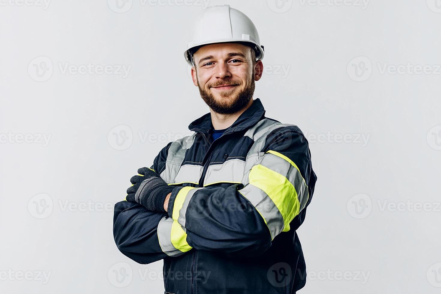 Portrait of a smiling man in a hard hat and safety vest photo
