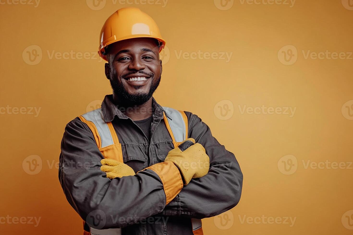 An african american man in a hard hat and safety vest photo