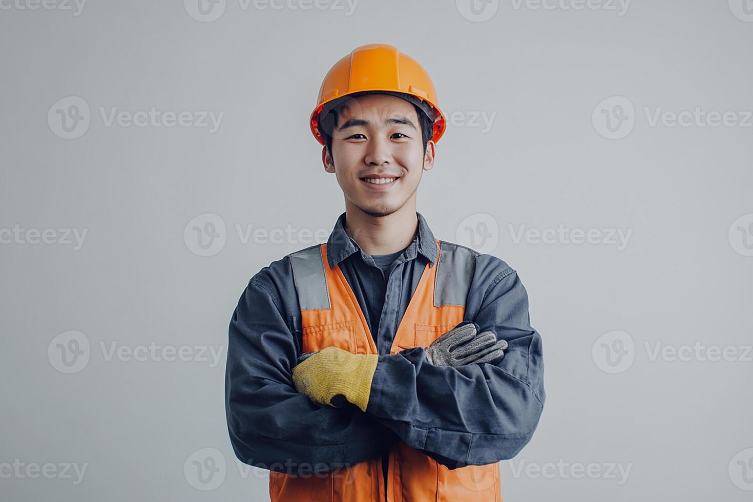 Asian male construction worker with his arms crossed photo