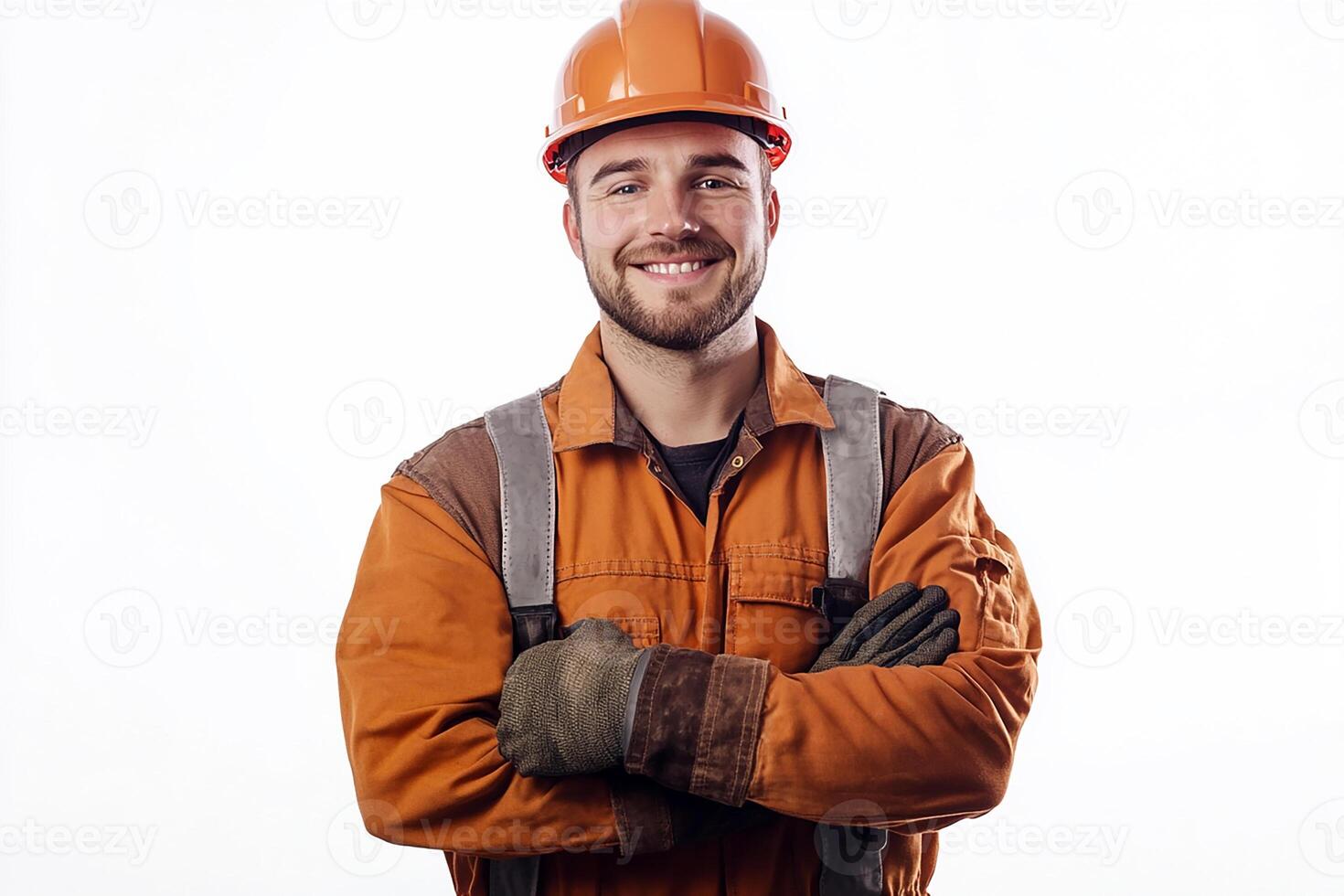 A man in an orange hard hat and overalls photo
