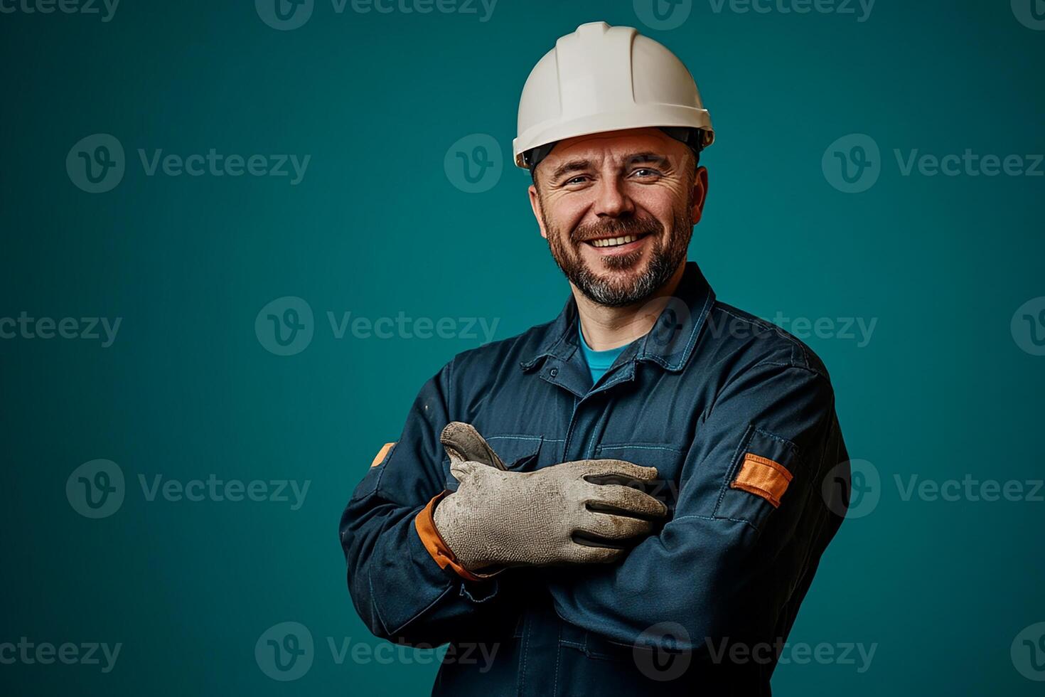 A man in a hard hat and gloves photo