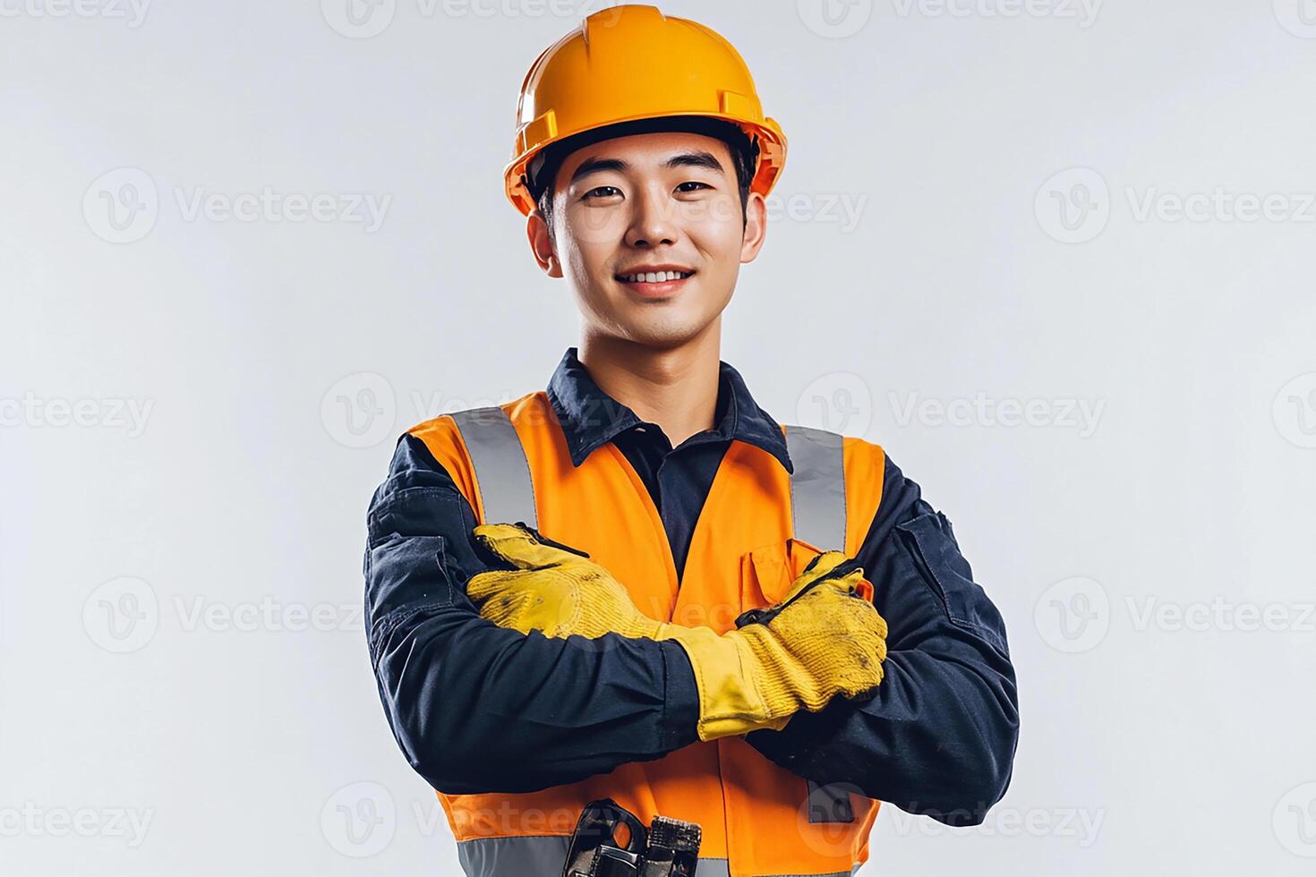Asian male construction worker with his arms crossed photo