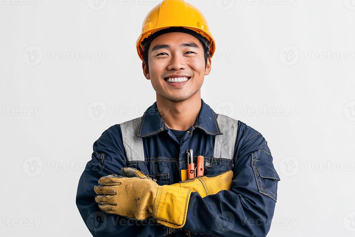 Asian male construction worker with his arms crossed photo
