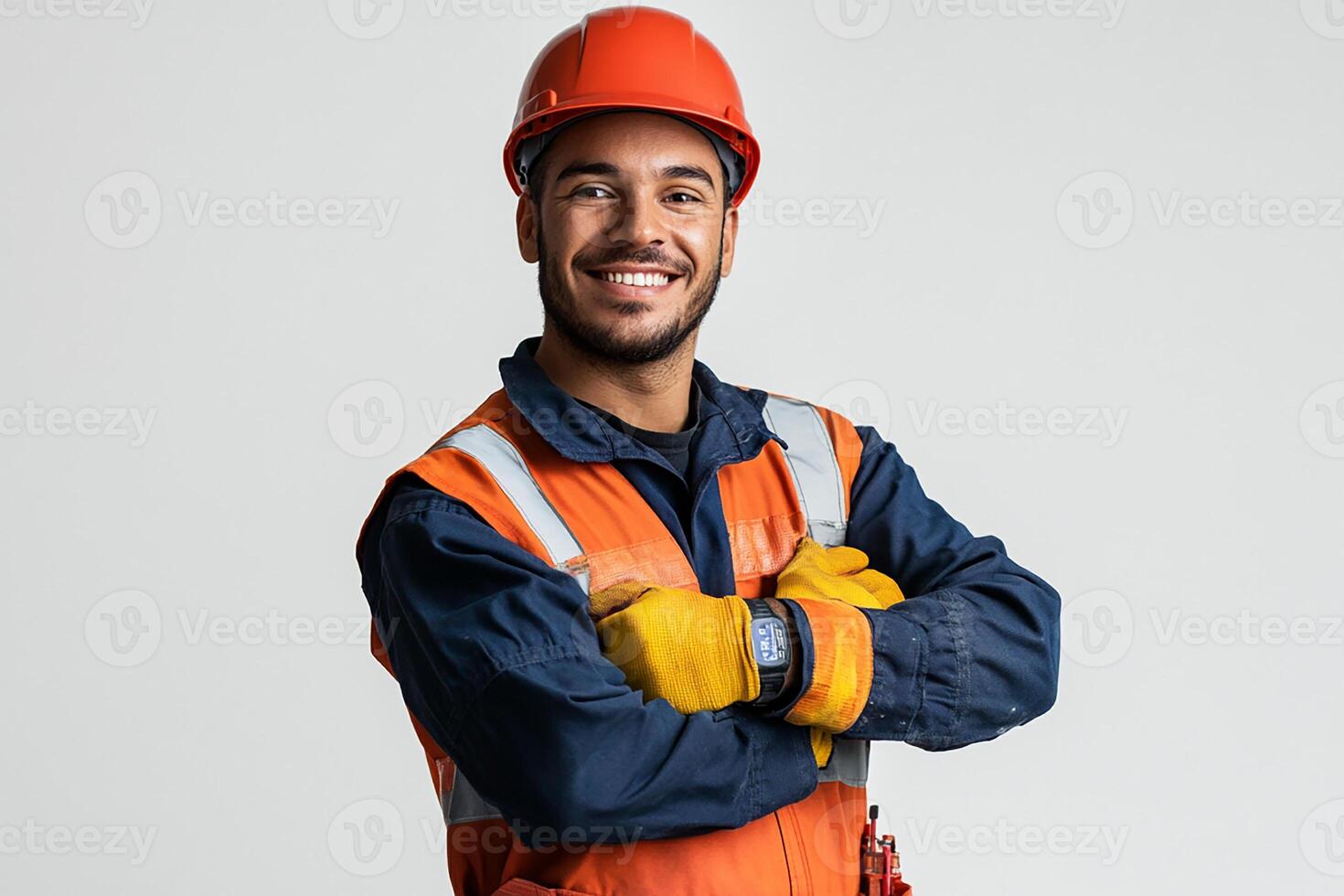 A smiling man in an orange vest and hard hat photo