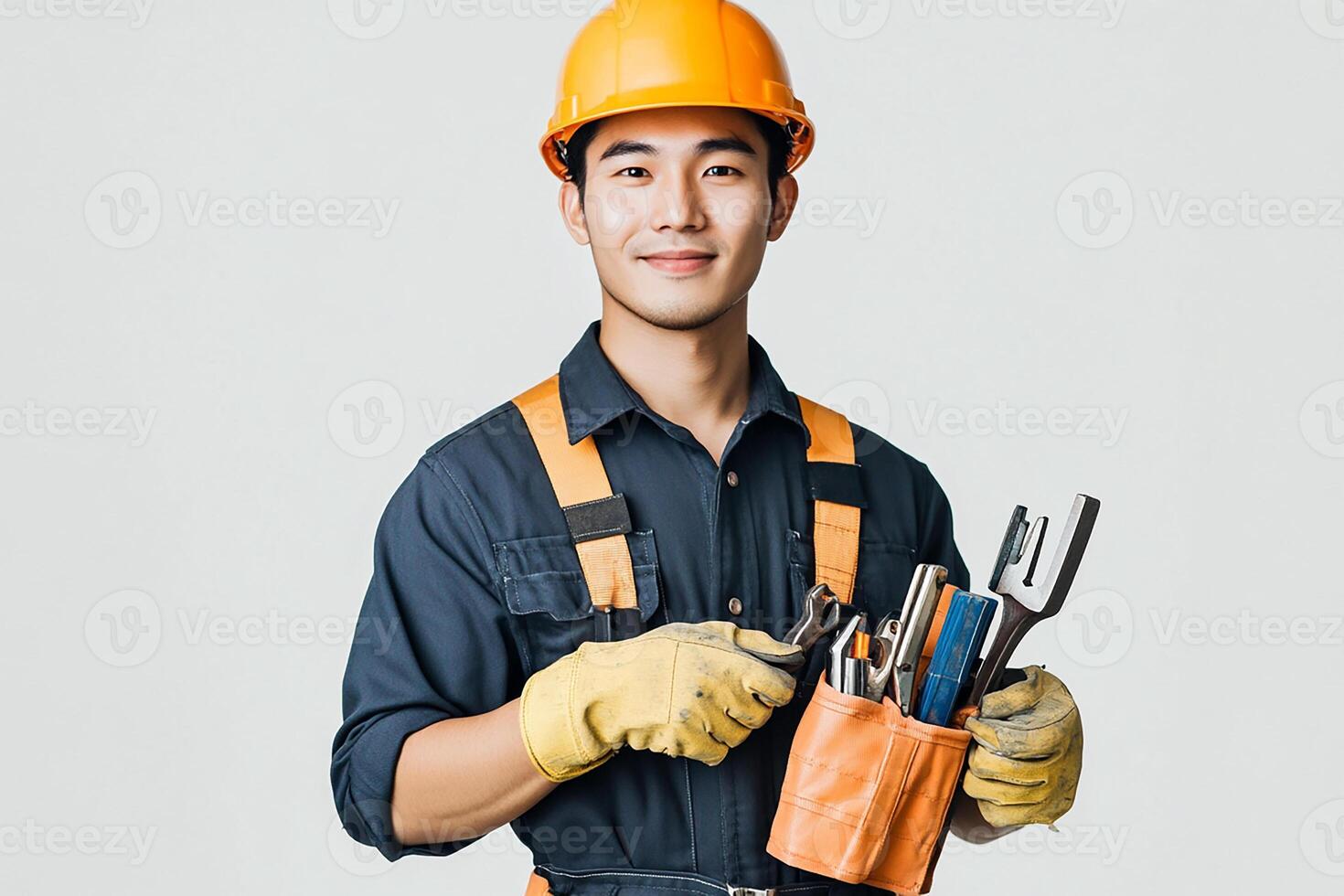 Asian male construction worker holding tools and tools photo