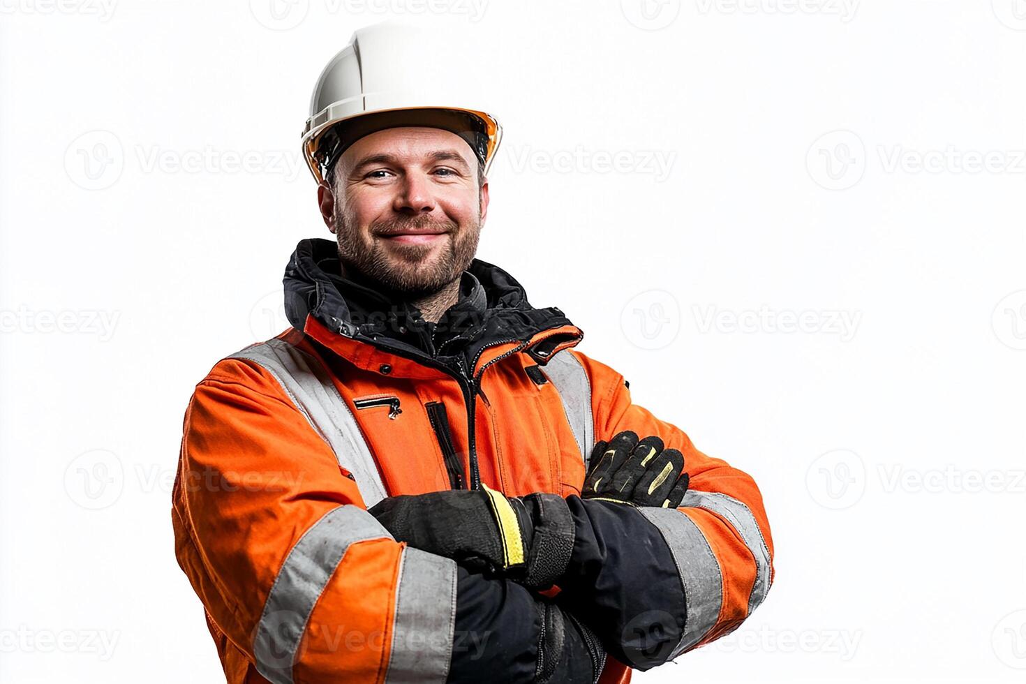 A man in an orange and black jacket and hard hat photo