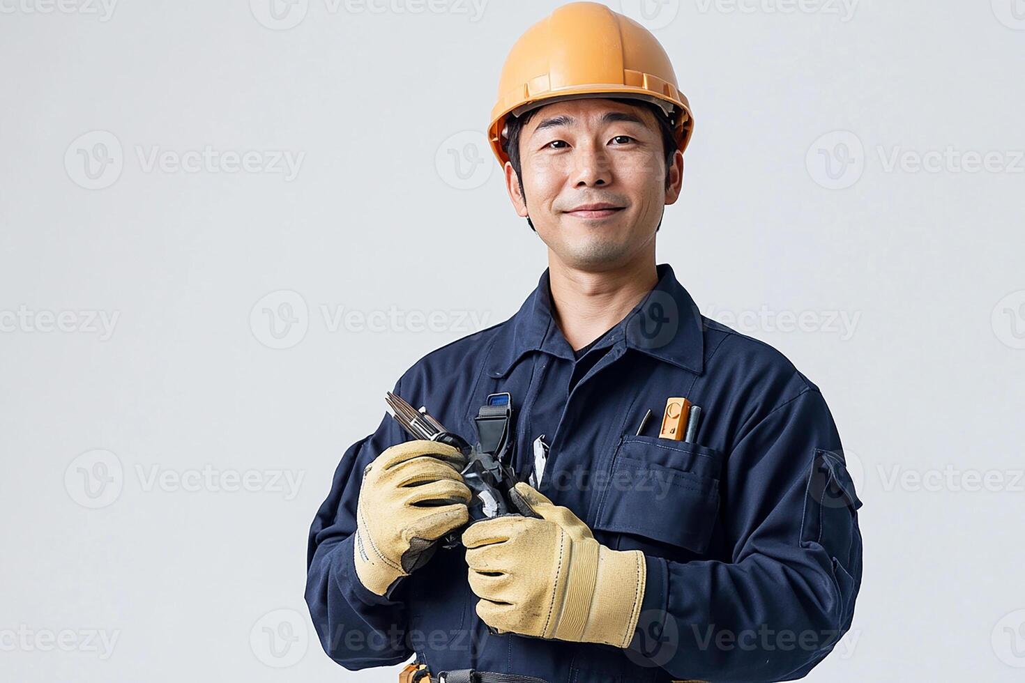Asian male electrician holding a wrench photo