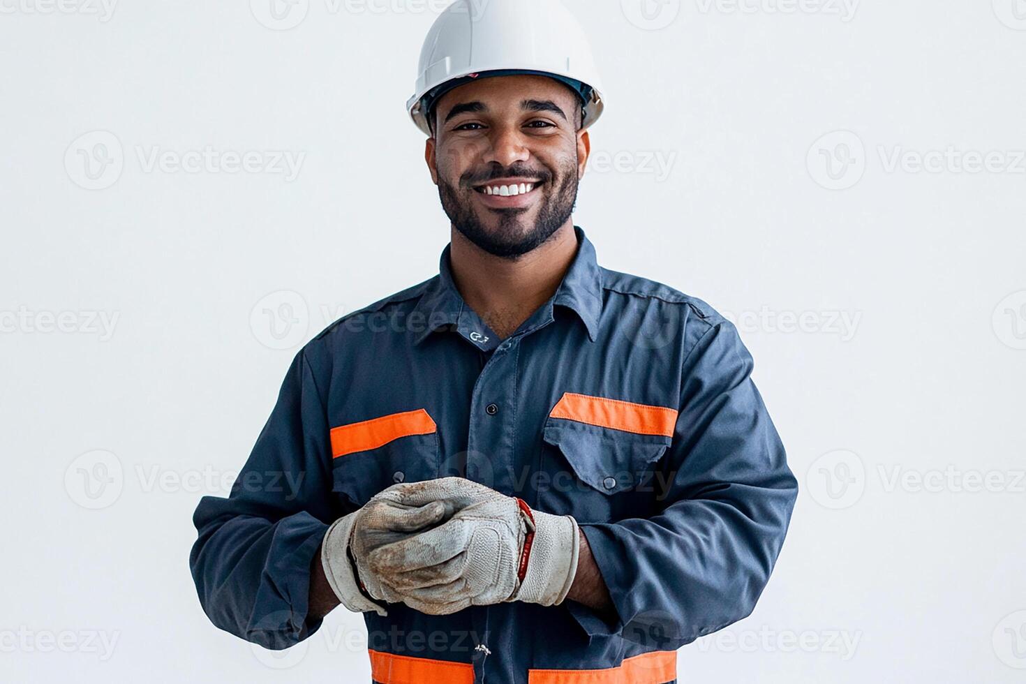 A smiling man in a hard hat and overalls photo