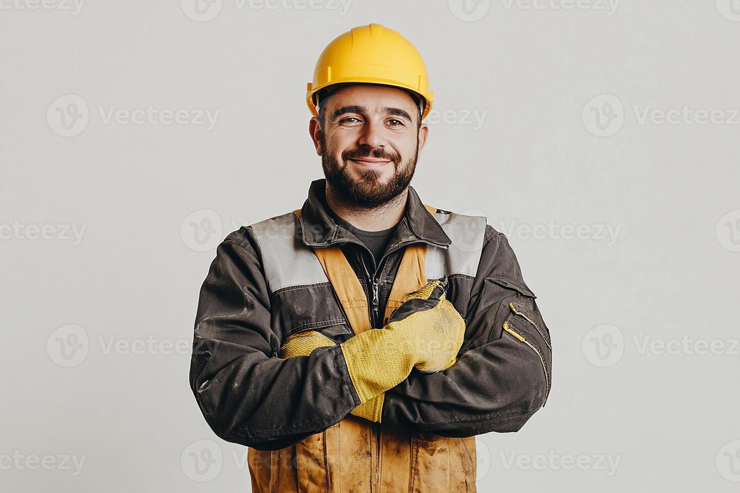 A smiling man in a hard hat and overalls photo