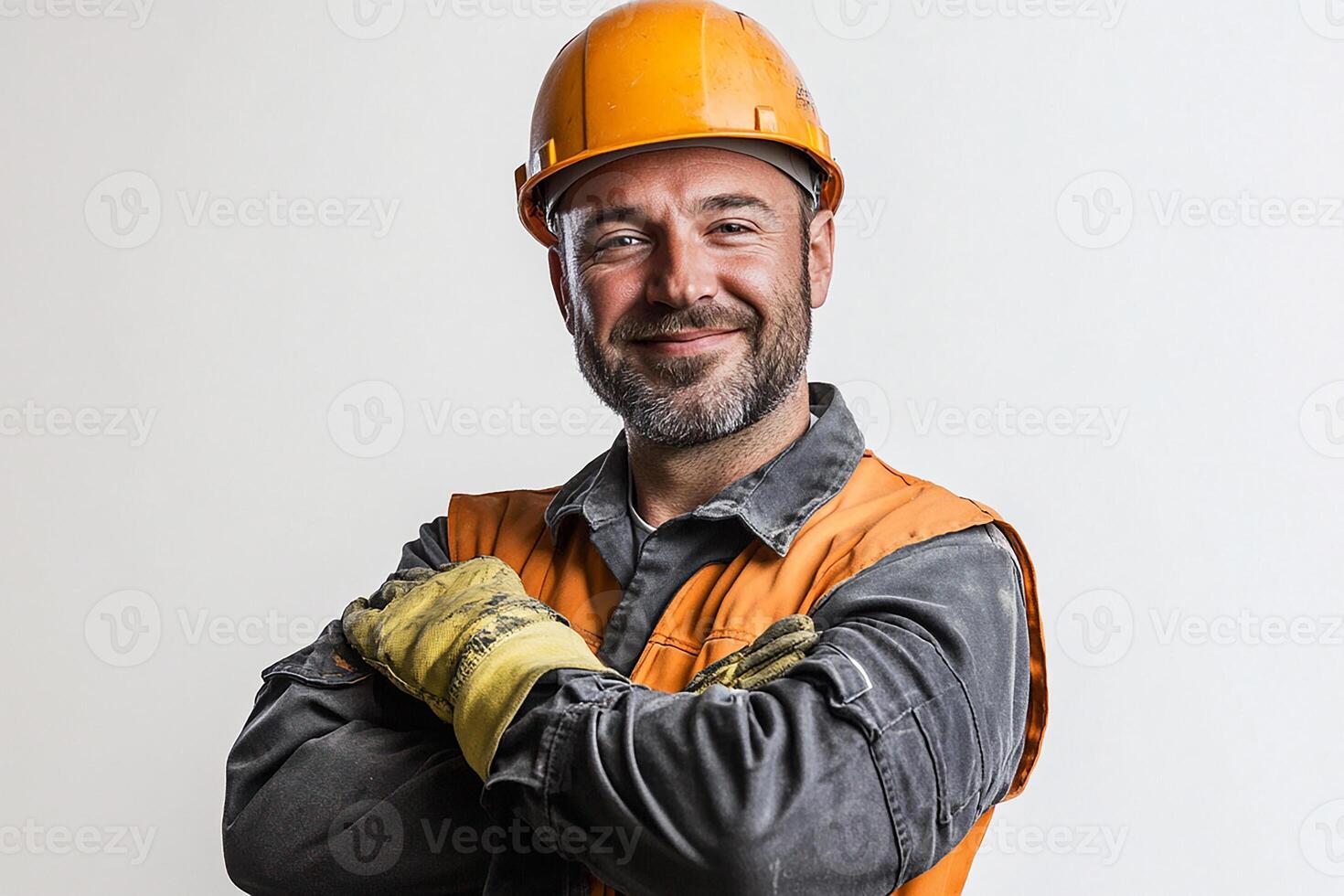 A man in an orange vest and hard hat photo