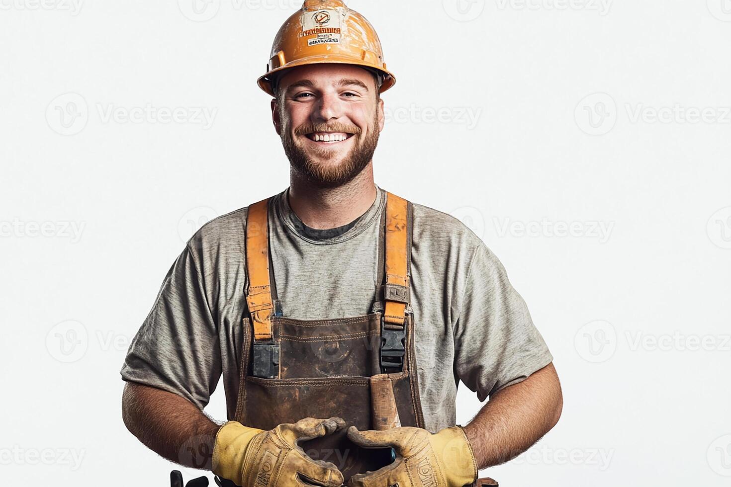 A smiling man in overalls holding a hammer photo