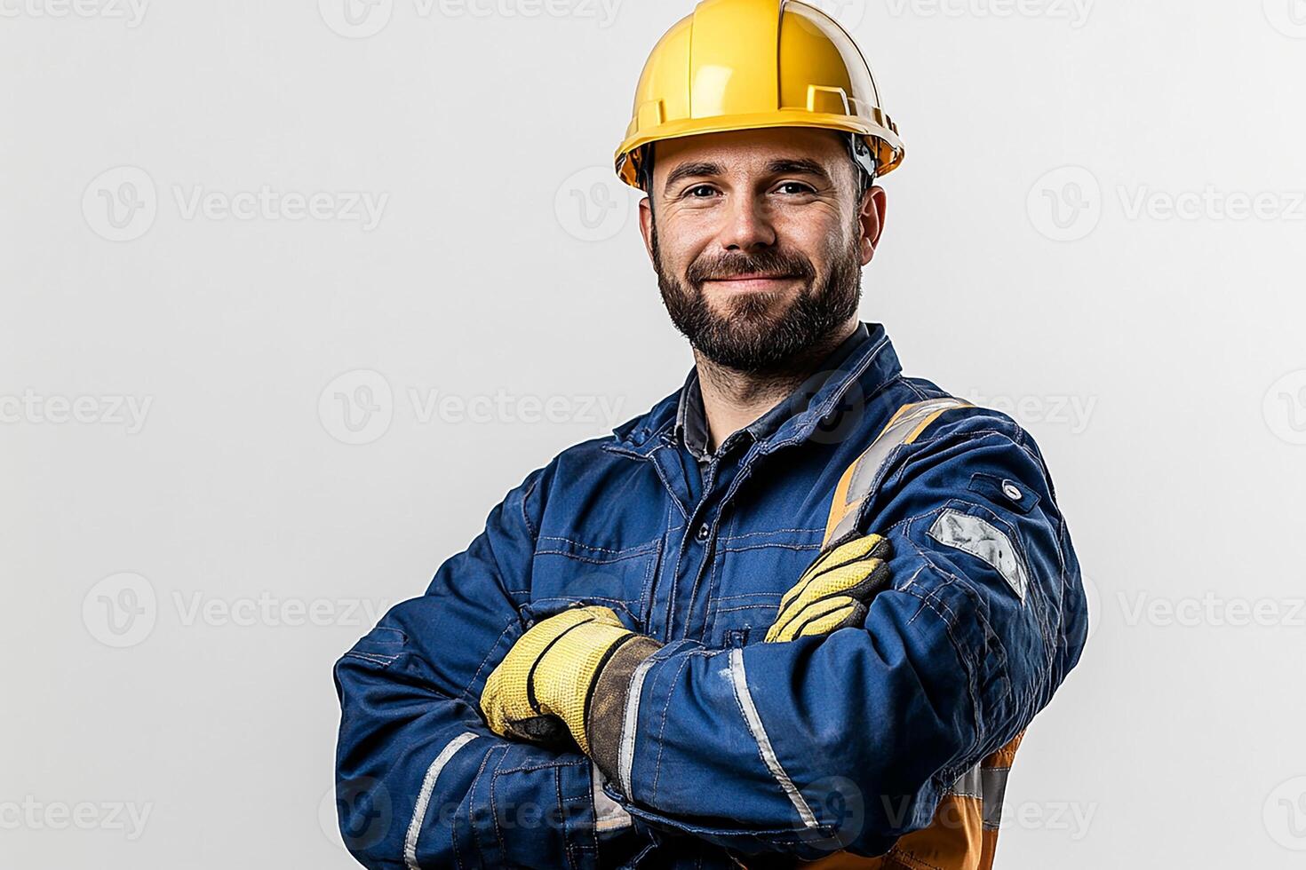 A man in a hard hat and overalls photo