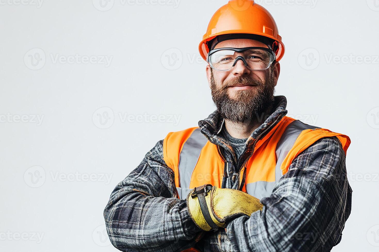 A man in an orange vest and safety glasses photo