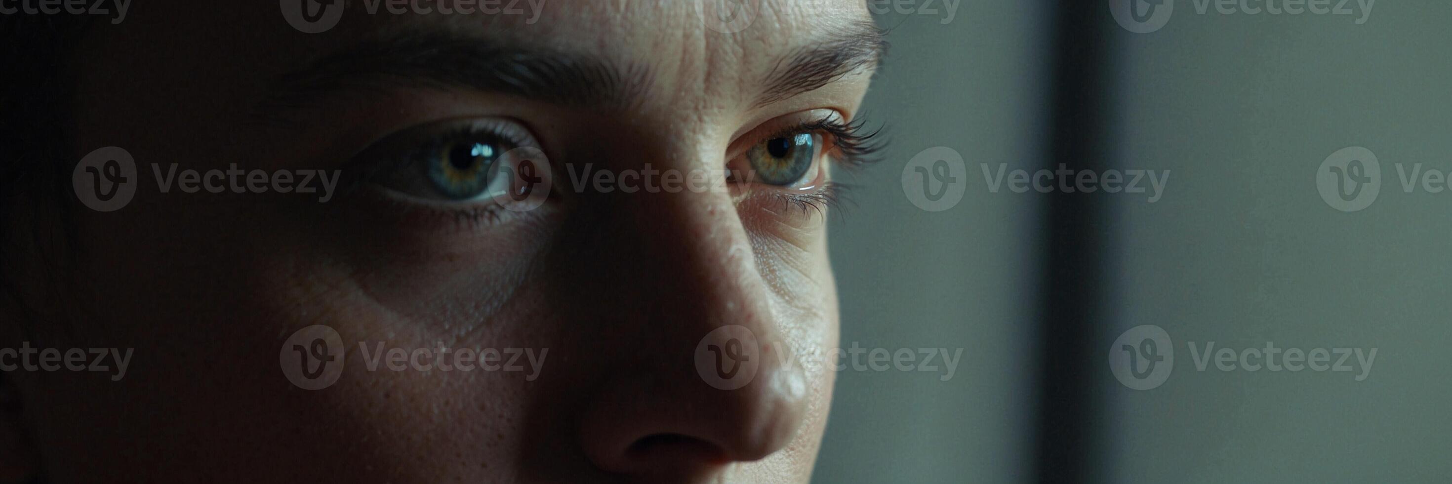 A close up of a woman's face with green eyes photo