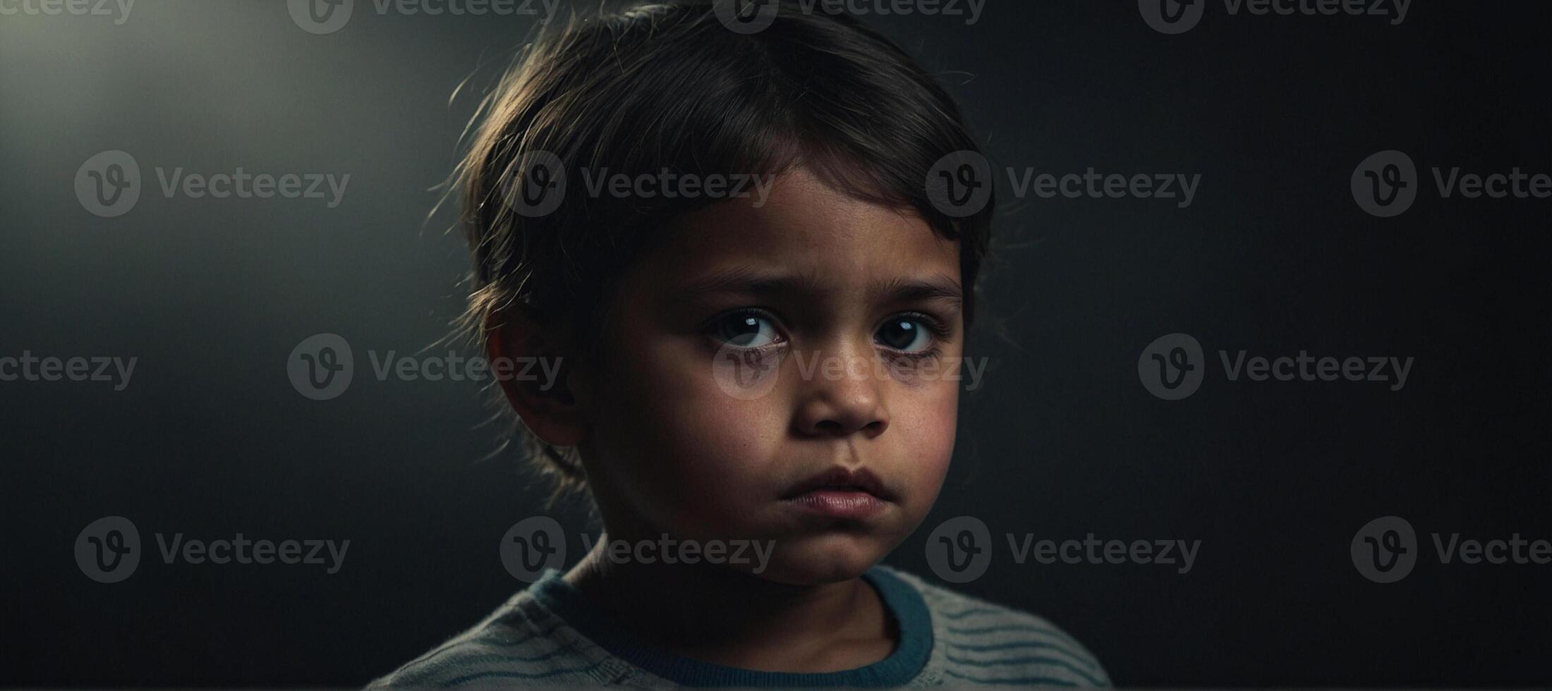 A young child staring into the camera photo