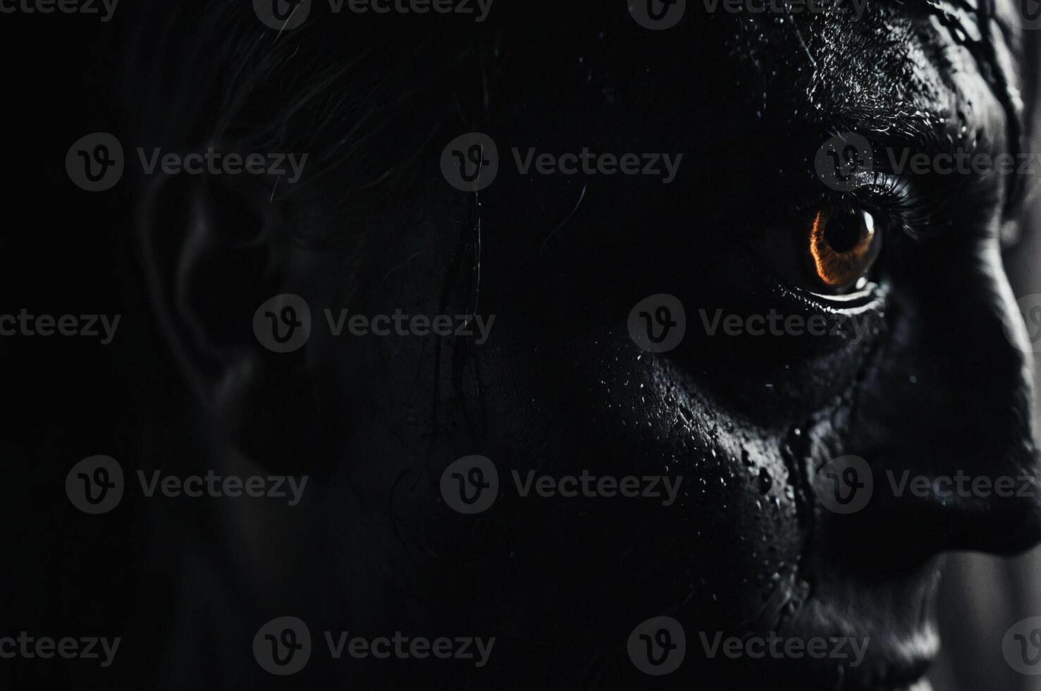 A man with a black face and orange eyes photo