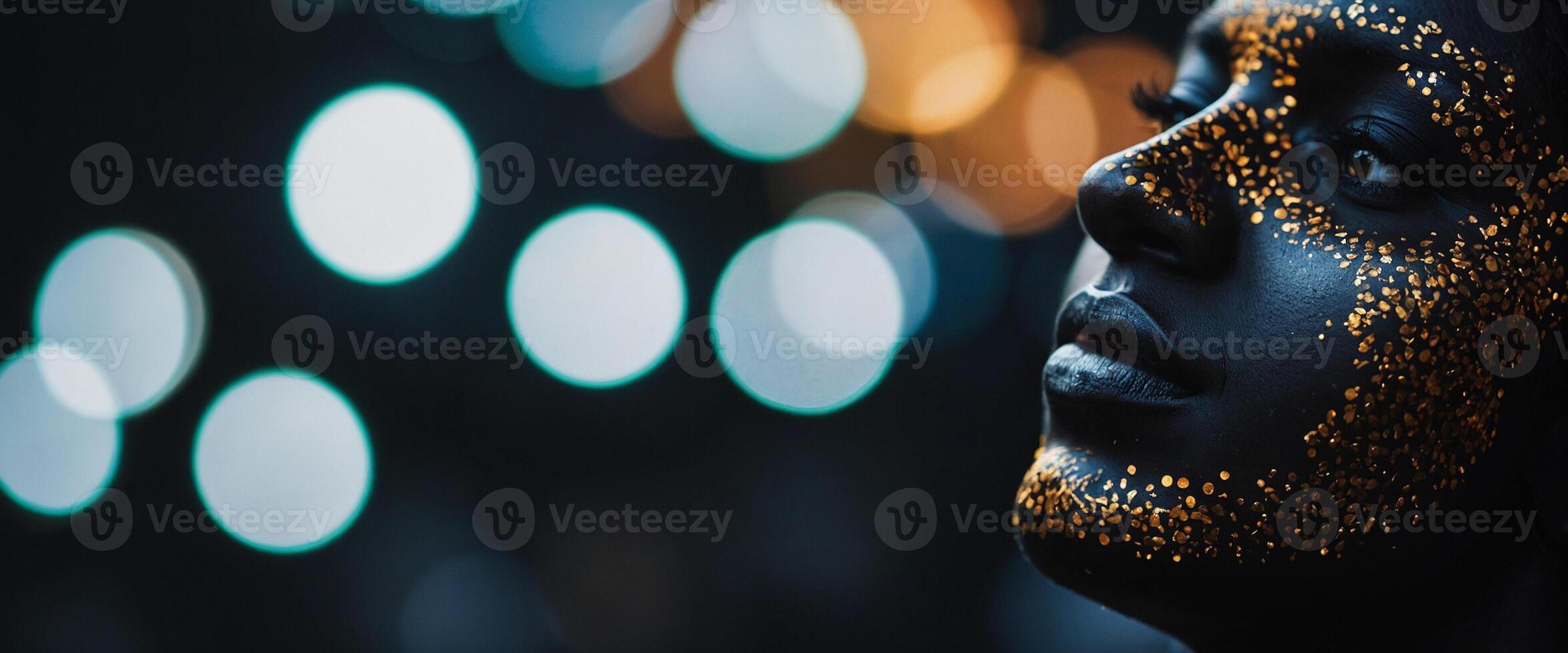 A woman with gold glitter on her face photo