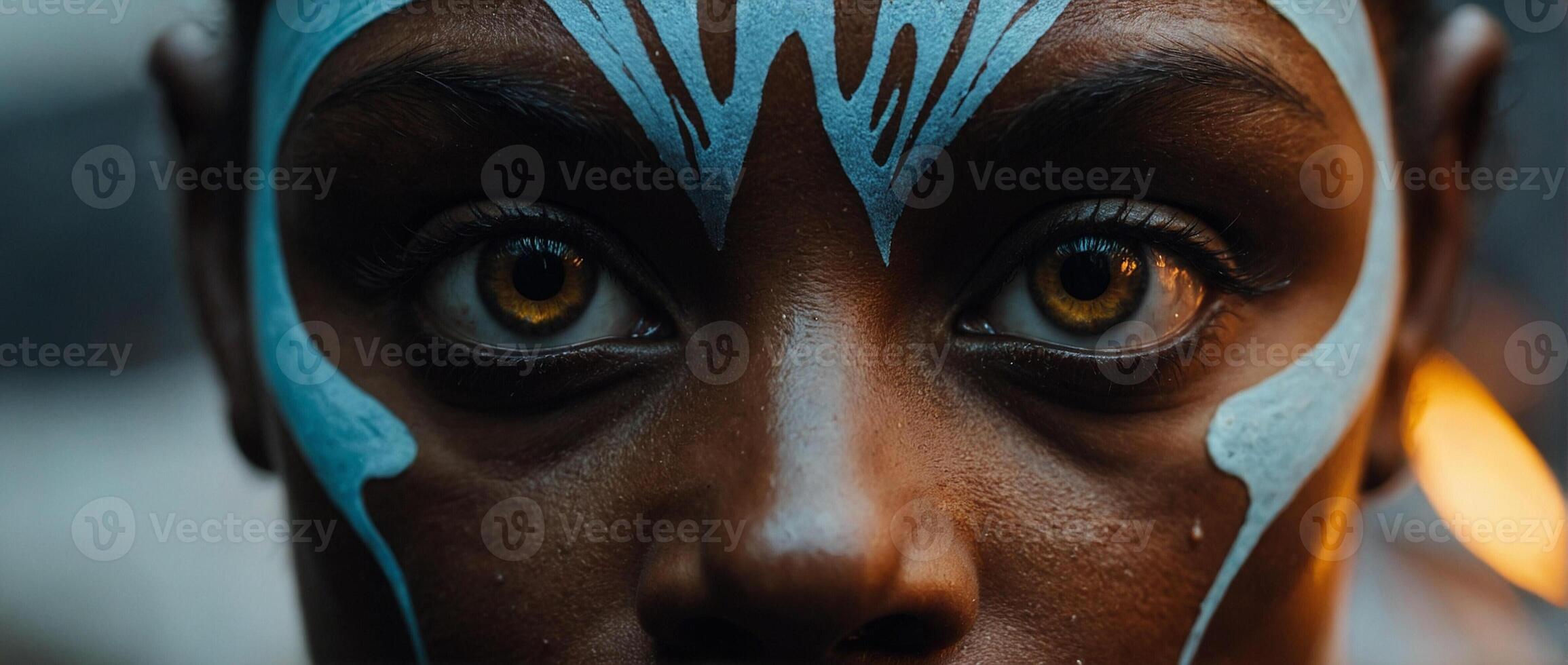 A woman with painted face and blue eyes photo