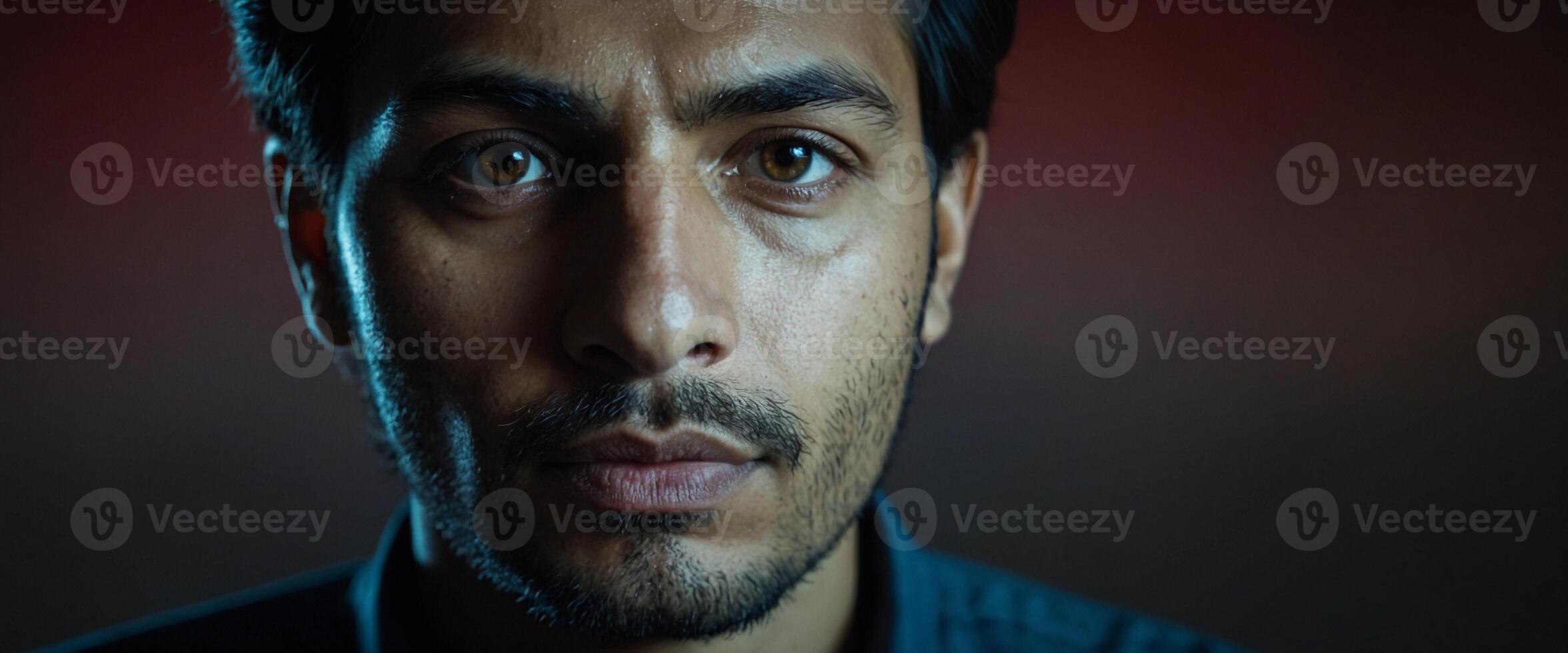 A man with a beard and dark eyes photo