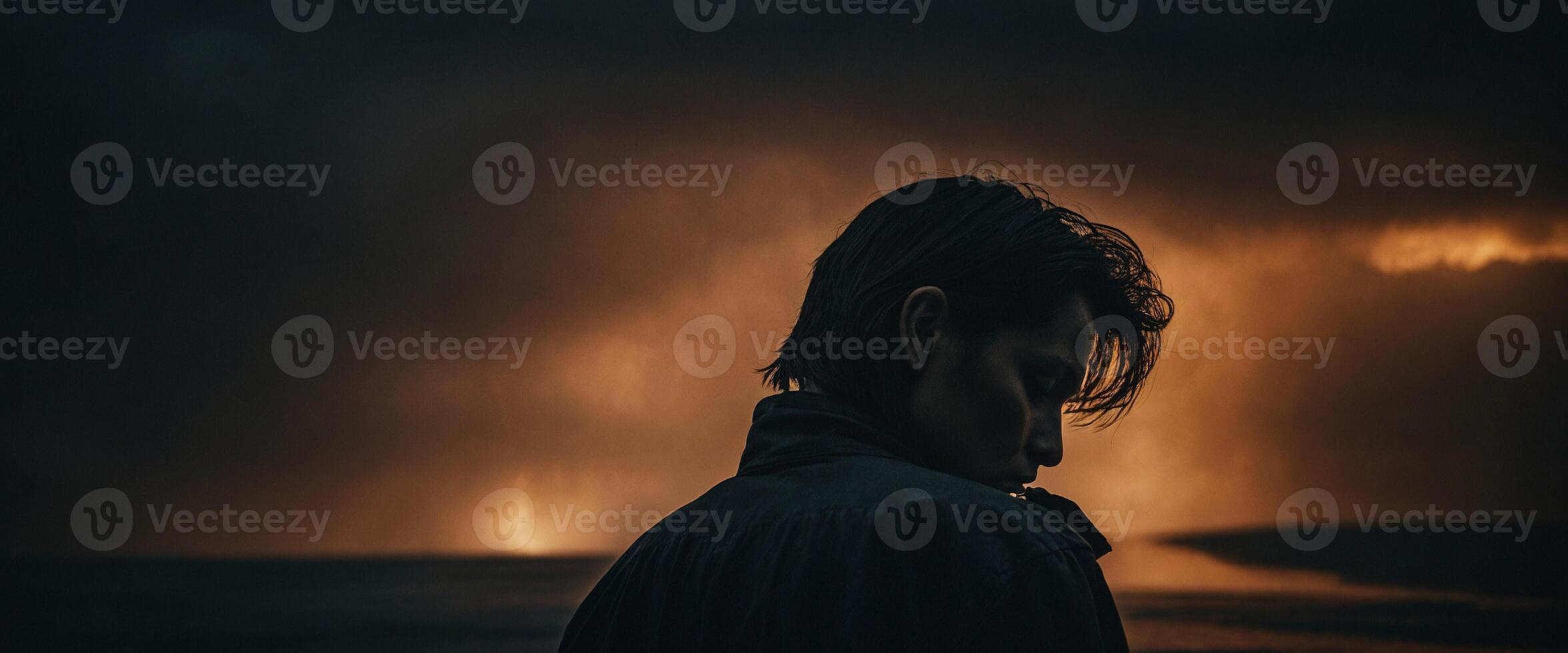 A man standing in front of a stormy sky photo