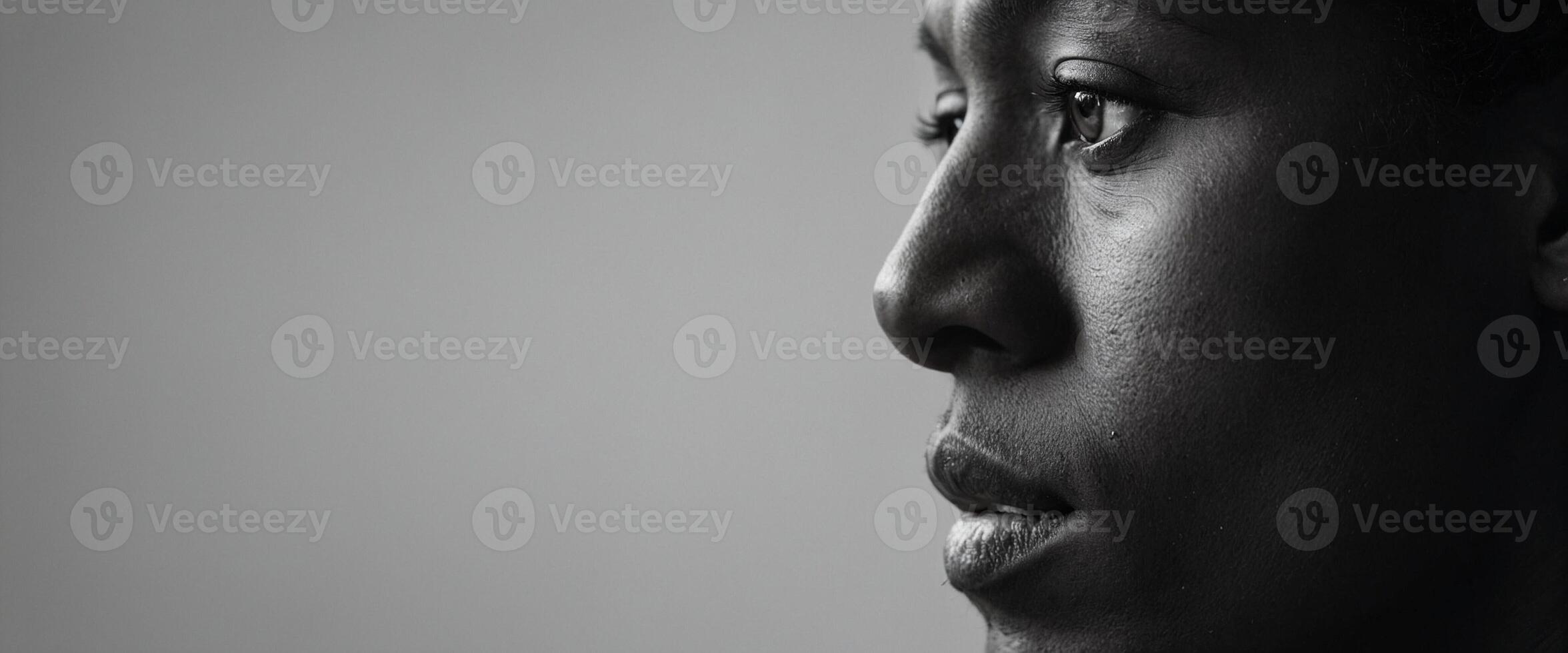 A black woman with a black background photo