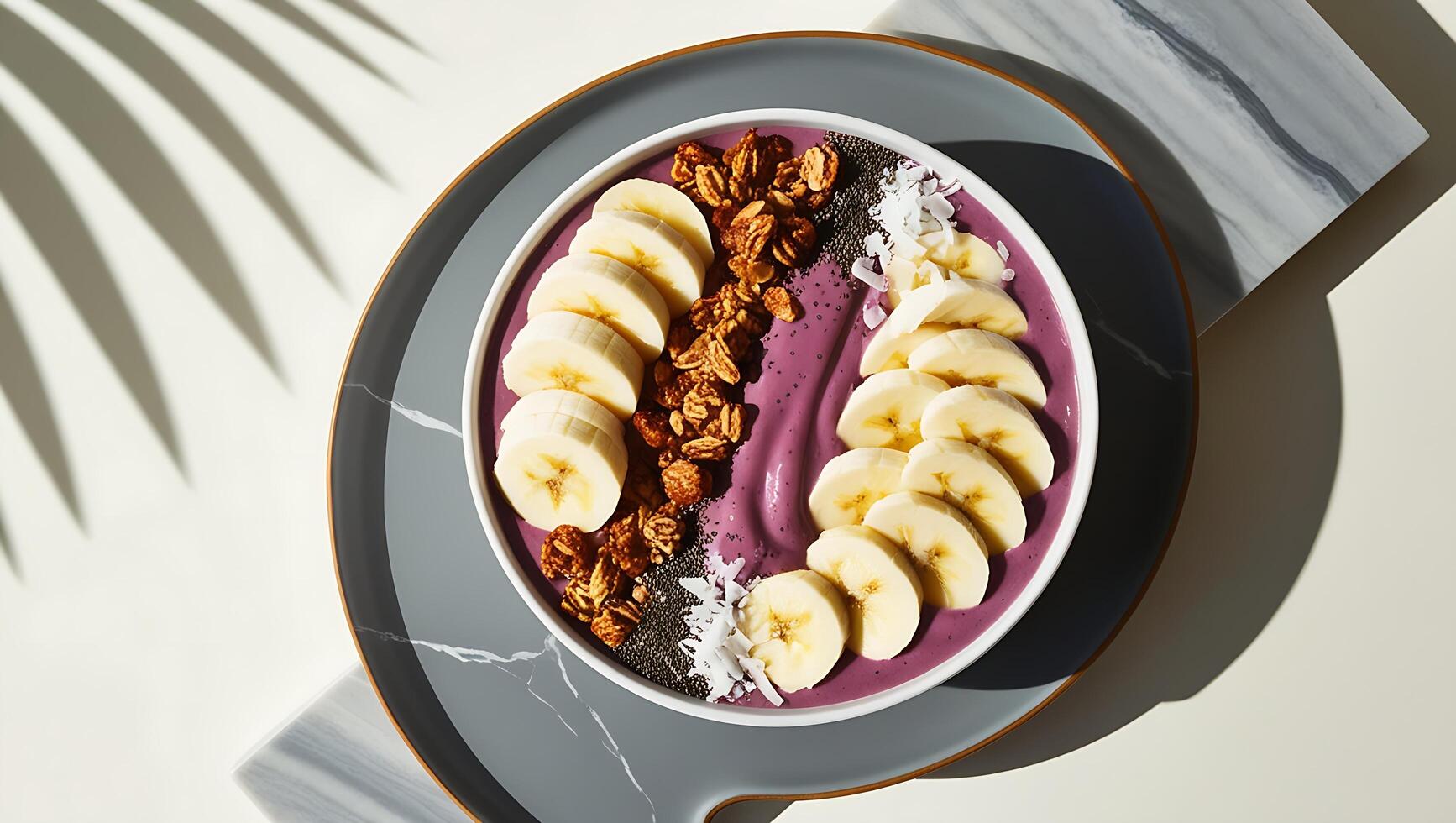 A bowl of blueberry smoothie with bananas and granola photo