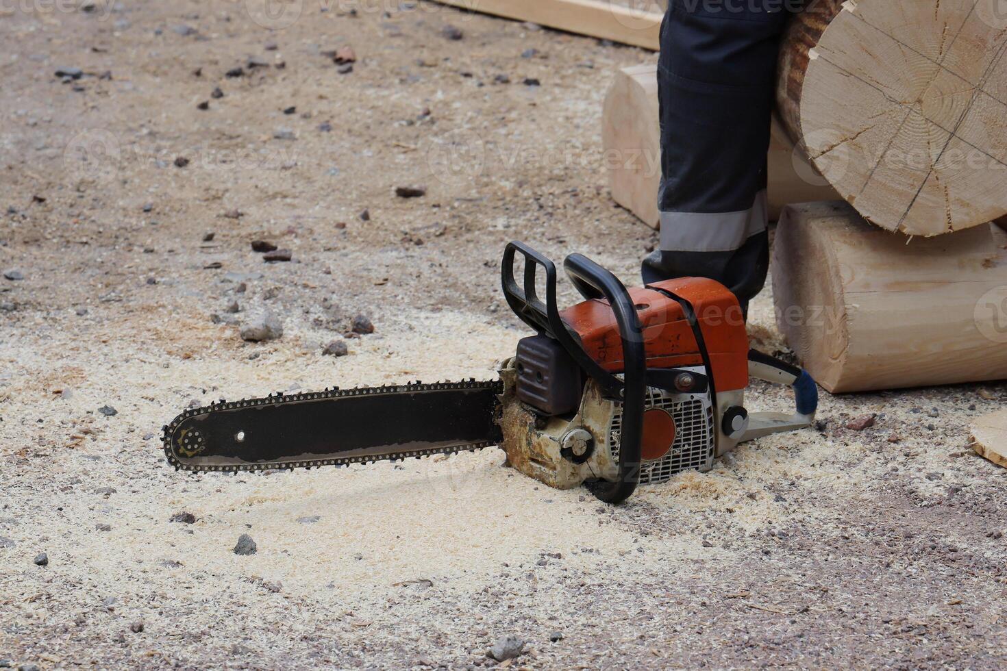 Chainsaw Cutting Wood in Motion a dynamic display of skill and efficiency in woodworking photo