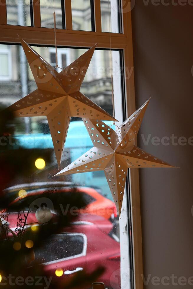 Decorative Paper Stars Designed for a Beautiful Holiday Window Display for All to Enjoy photo