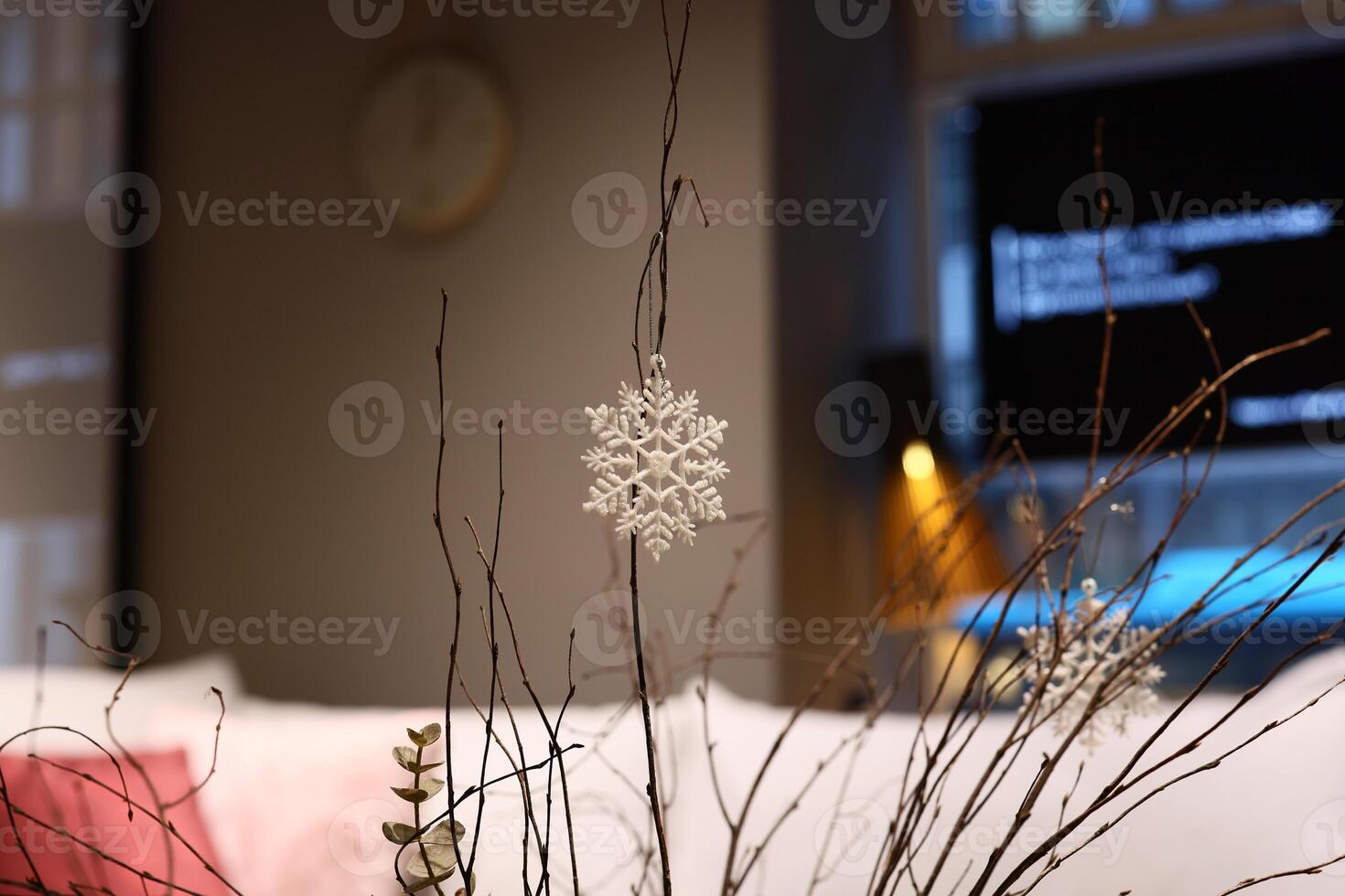 Experience Winter Decor Featuring Charming Snowflake and Twigs in a Cozy Living Space photo