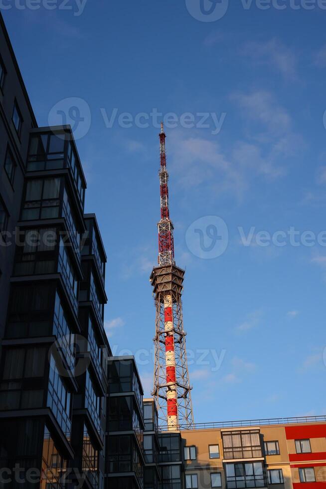 Urban skyline with a prominent communication tower in the cityscapes architecture photo