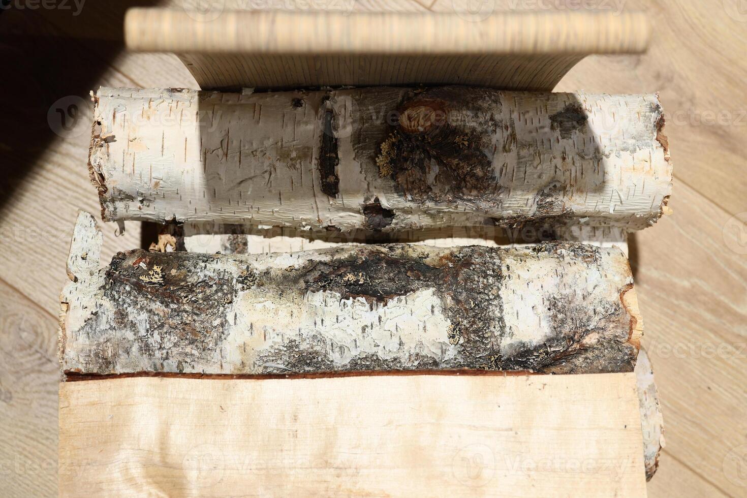 Natural Birch Logs Displayed on a Beautiful Wooden Surface for Creative Inspiration photo