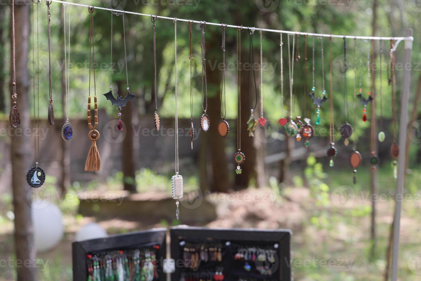 A Colorful Jewelry Display Hanging Beautifully in Nature for All to Admire and Enjoy photo