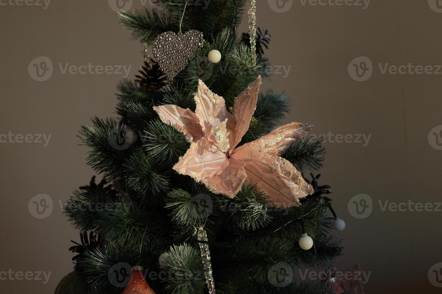 A Beautifully Decorated Christmas Tree Adorned with Unique and Eyecatching Ornaments photo