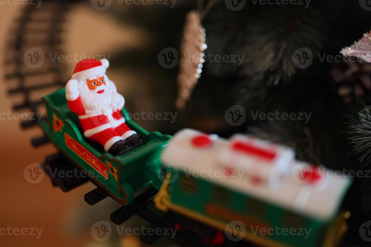 A beautifully crafted Festive Santa Train Ornament adorning the Christmas Tree brings joy photo