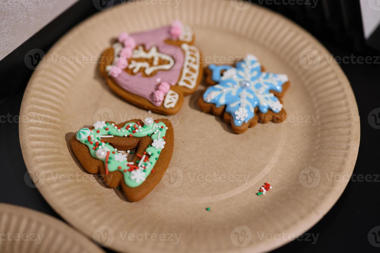 Beautifully Decorated Holiday Cookies Arranged on a Festive Paper Plate for Everyone photo