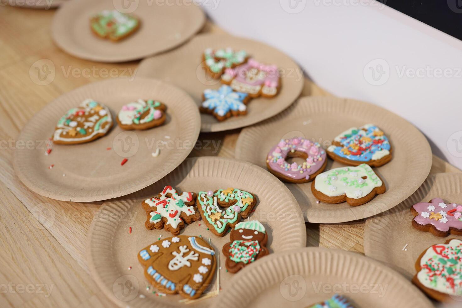 Festively Decorated Holiday Cookies Beautifully Arranged on Plates for Everyone to Enjoy photo