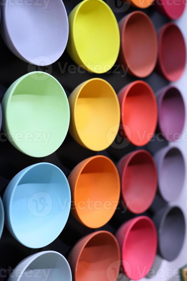 A Diverse Collection of Colorful Circular Vessels Displayed and Richly Arranged photo