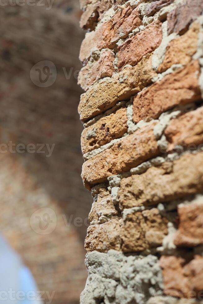 A beautifully textured brick wall structure that showcases its own rustic and charming appeal photo