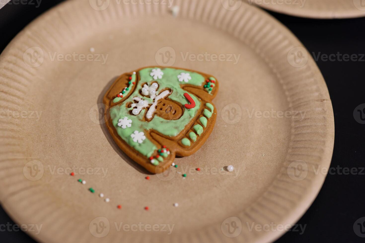 A Delicious and Festively Decorated Gingerbread Cookie in the Charming Shape of a Sweater photo