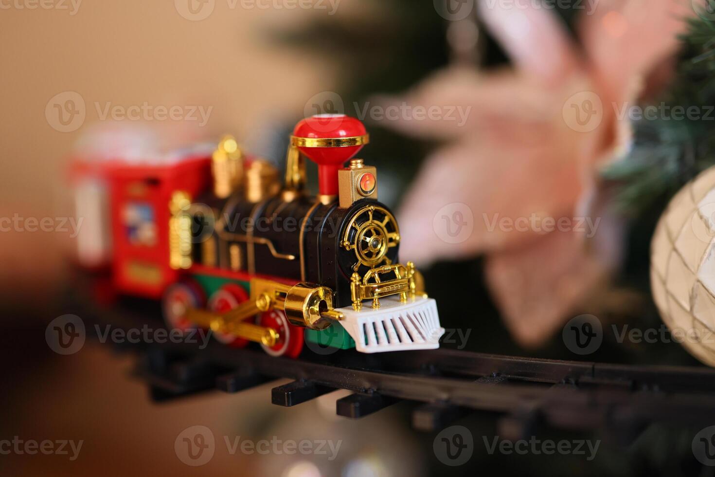 A Colorful and Vibrant Toy Train is Elegantly Displayed During the Festive Holiday Season photo