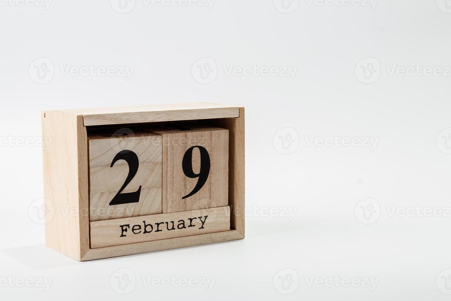 Wooden calendar February 29 on a white background photo