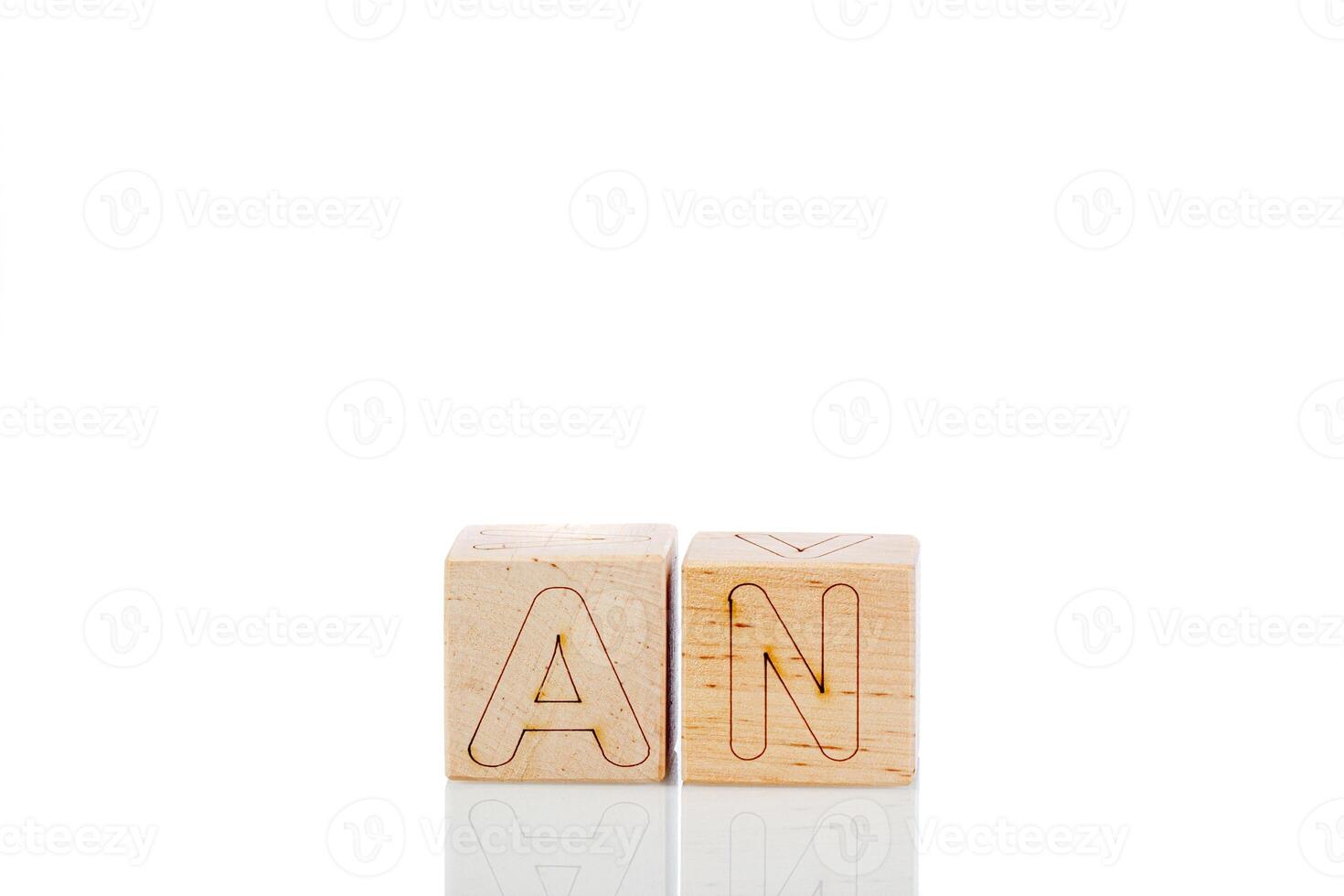 Wooden cubes with letters an on a white background photo